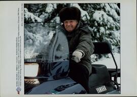 EPA/ITAR-TASS: "Russian President Boris Yeltsin enjoys a ride on a snowmobile near his Valday residence, 13 January 1998. Boris Yeltsin has been relaxing at the Valday rural residence since January 4". Valday, January 14th., 1998.